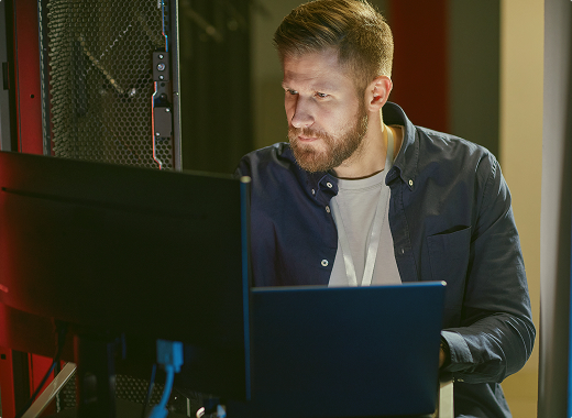 Technology recruitment professional working at a computer